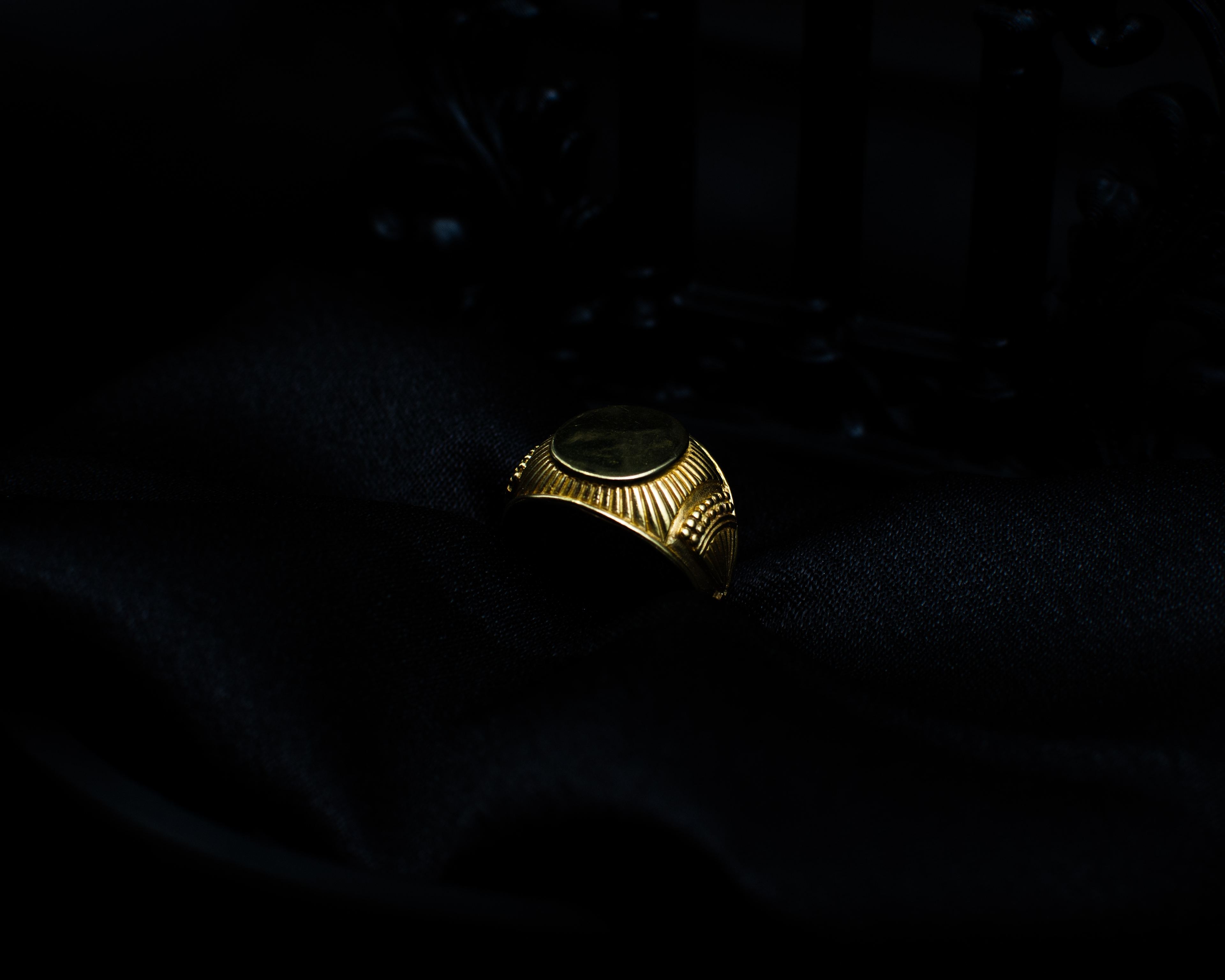 Panchadhatu Signet Ring 2 support view on black satin