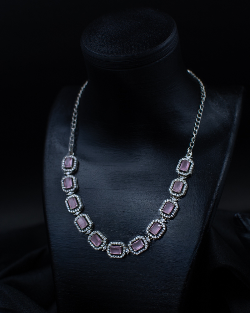 Purple Set necklace with square purple stones on black display