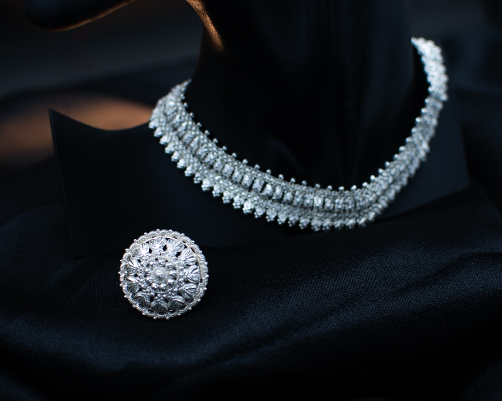 Silichung necklace and ring shown on a black bust display