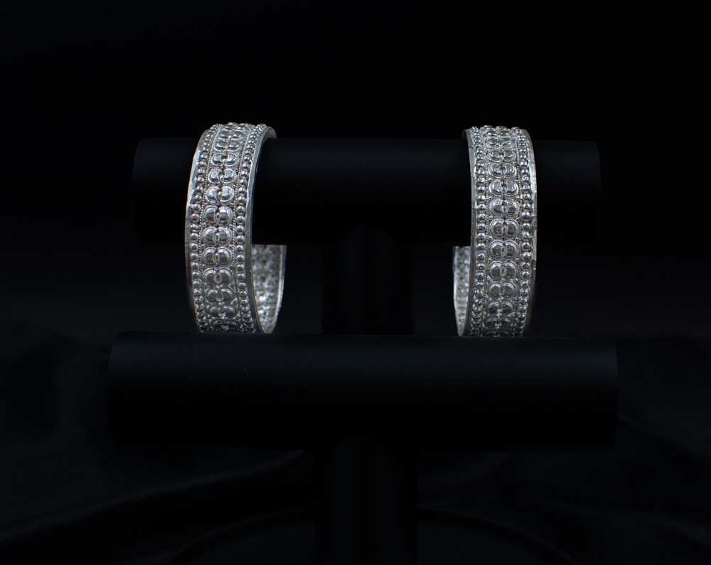 Silichung Bracelet pair close-up on black display stand