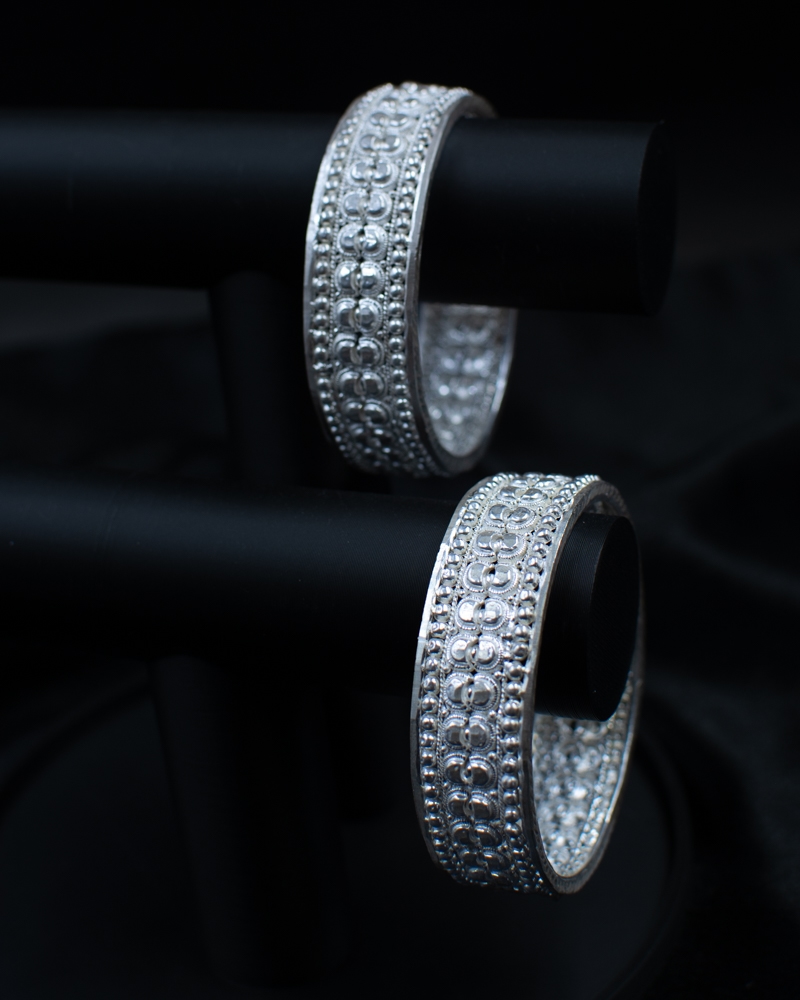 Silichung Bracelet pair displayed in a white shell bowl
