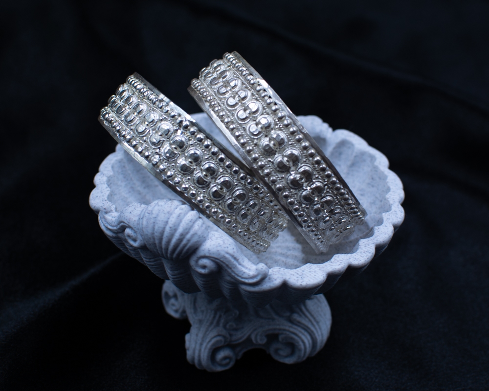 Silichung Bracelet pair close-up in white shell bowl