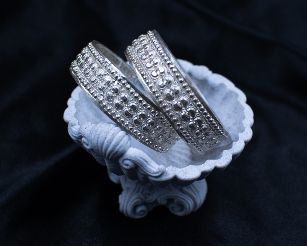 Silichung Bracelet pair in white shell bowl from above