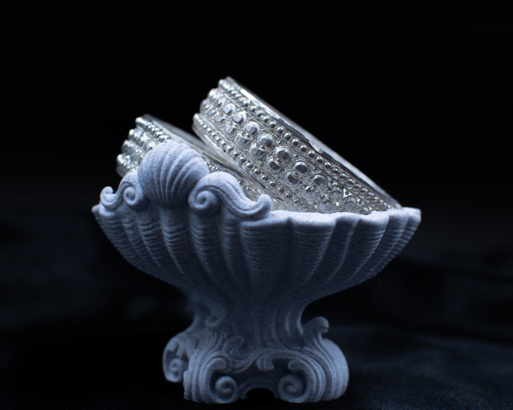 Silichung Bracelet pair side view in white shell bowl