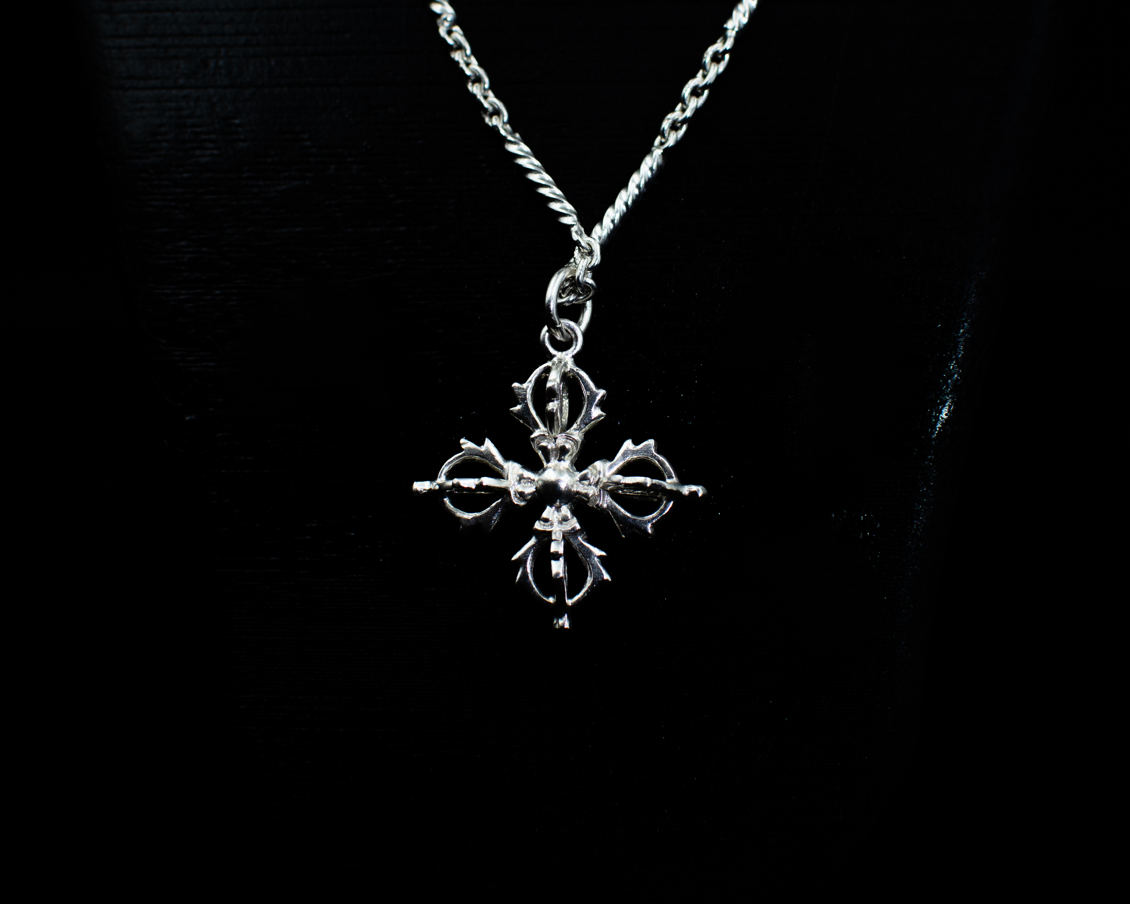 The Vishvavajra Pendant on a black necklace bust