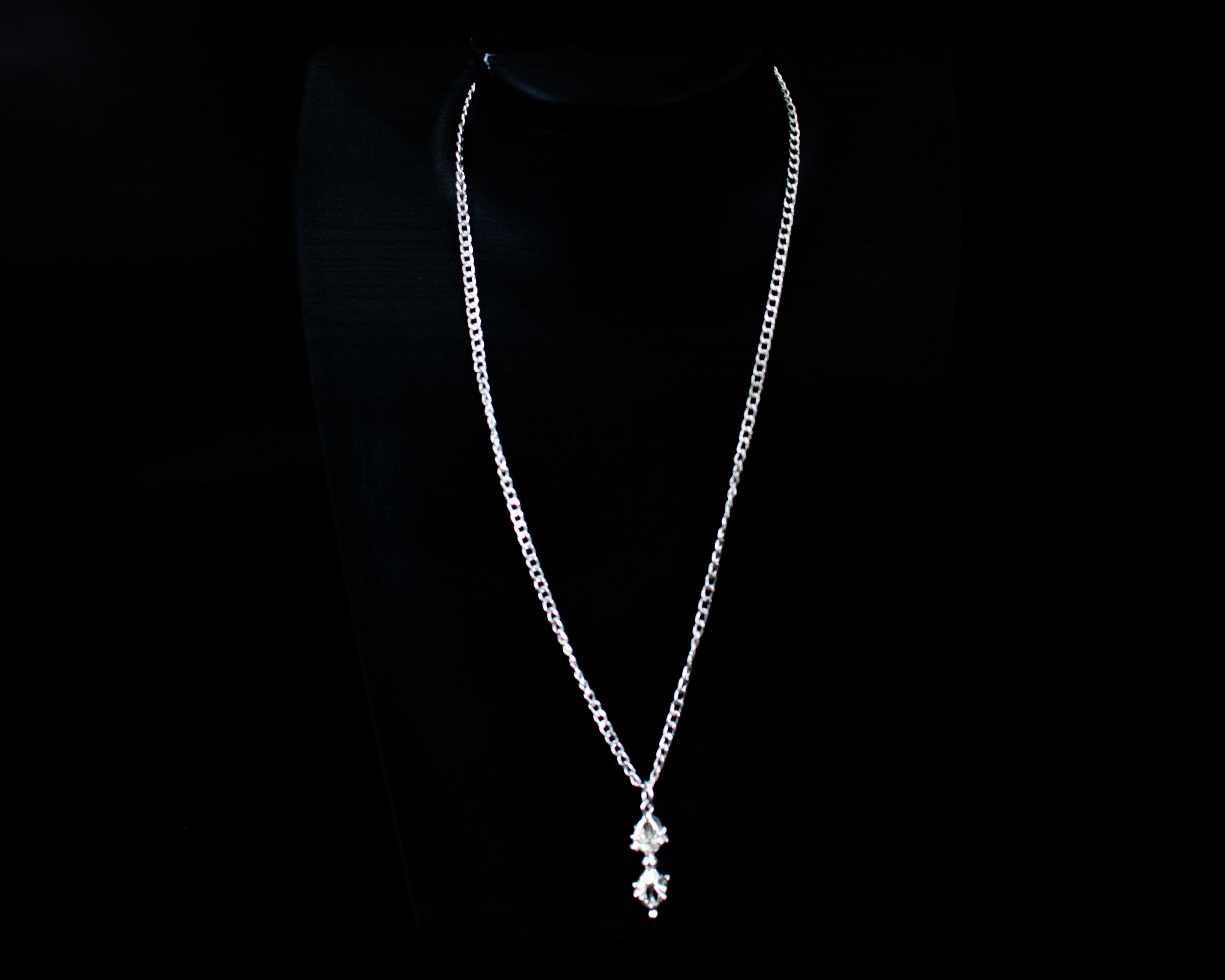 The Pañcha Vajra Pendant close-up on black display